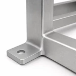 Close-up of an aluminum cabinet frame corner mounting bracket with round hole