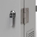 Close-up of keyed cam lock handle and stainless steel hinge on a powder-coated outdoor electrical enclosure