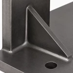 Close-up of a smooth continuous weld on a reinforced steel corner gusset