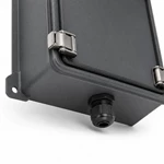 Close-up of black cylindrical cable gland fitting on bottom edge of waterproof metal enclosure